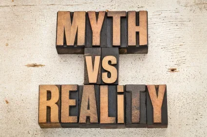 Copper-colored letters spell out Myth vs Reality