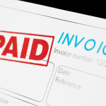 The word "invoice" appears in blue at the top of a page with "paid" stamped in red and outlined in a rectangle.