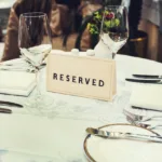 formal table setting with a reserved sign