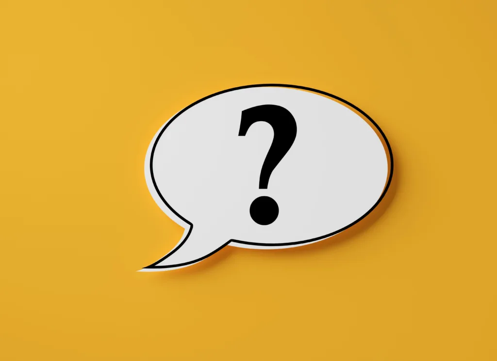 A white speech bubble outlined in a thin black line and with a thick black question mark in the middle sits against a mustard yellow background.