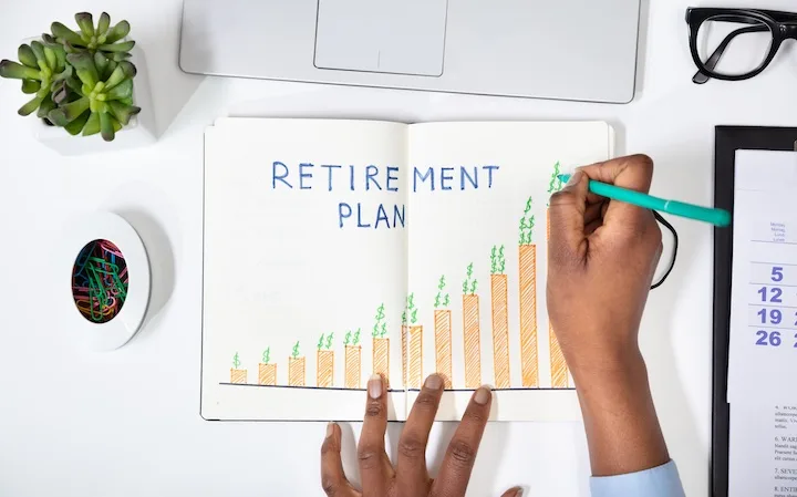 A person sketching a retirement plan design